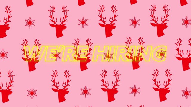A yellow neon we're hiring sign on a white background, with a christmas pattern on a green screen