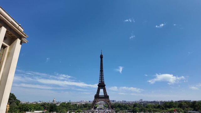 Eiffel tower rises above the cityscape of paris as tourists gather on the trocad&eacute;ro esplanade, enjoying the iconic landmark and the vibrant atmosphere of international travel and european tourism