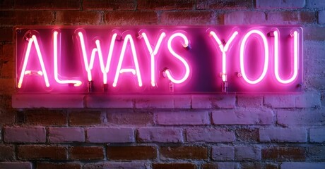 Fototapeta premium Bright pink neon sign displays words ALWAYS YOU against textured brick wall. Dramatic lighting creates vibrant contrast.