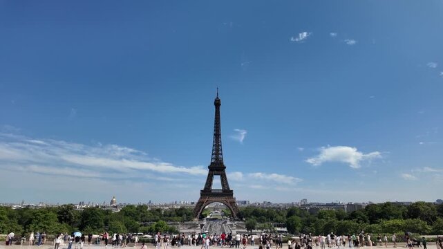 Eiffel tower rises above the cityscape of paris as tourists gather on the trocad&eacute;ro esplanade, enjoying the iconic landmark and the vibrant atmosphere of international travel and european tourism