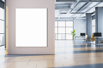 Vertical blank poster frame on wall in modern open space office with corridor and computer desks in contemporary business interior design. 3D Rendering