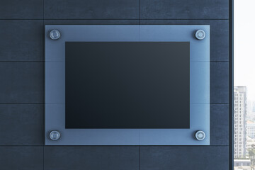 Blank signage mockup template on dark stone wall with metallic frame and bolts in front view, clean...
