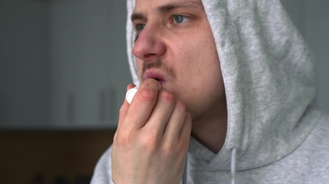 Cold sores on the lips.
Using chapstick to moisturize lips