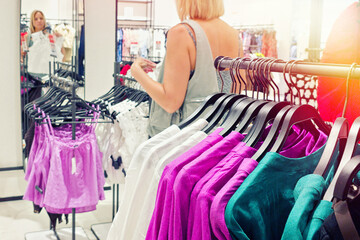 Woman near mirror in clothing store