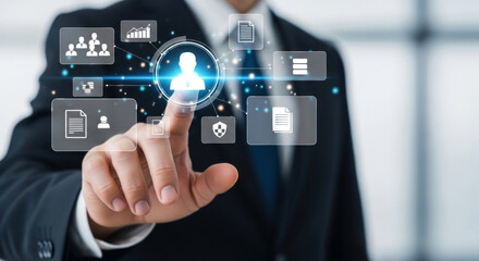 Naklejka premium Businessman interacting with digital user interface for business management and data