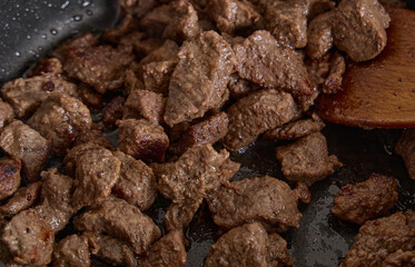 Sizzling Beef Cubes Cooking in Nonstick Pan