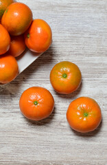 tangerine on wooden table, fruit