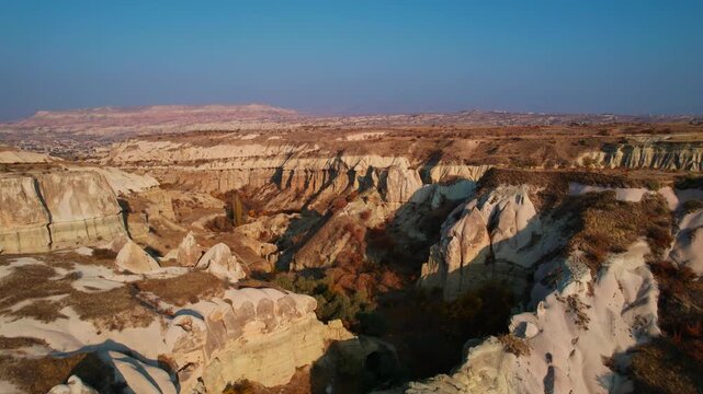 Breathtaking aerial view of majestic cappadocia landscapes at sunset, tuff rocks.