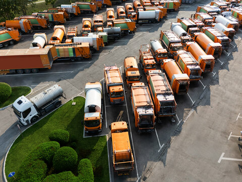 Fleet of yellow garbage trucks. Aerial view
