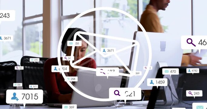 Business team typing on laptops in office, showing overlaid email icons and notification badges