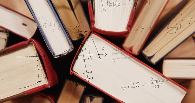 Faint arrows appearing on page over radial books forming axes plotting graphs illustrating calculus