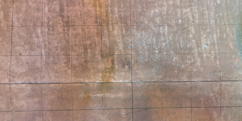 Obraz premium top view of surface of pedestrian path with paving slabs with the border of light and shadow