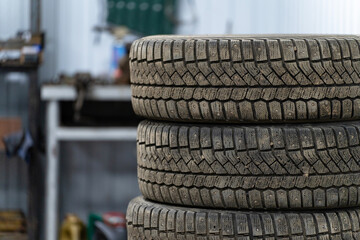 A stack of winter tires in a car repair shop
