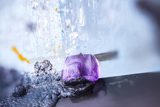 Purple Fluorite on black Schorl and blue Aquamarine. Specimen from Erongo Complex, Namibia Micro photography extreme close-up. microscope mineral crystal photography for Scientific use.