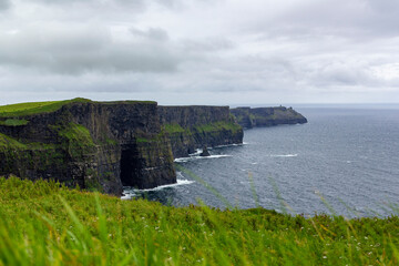 a rainy and stormy summer day at the famous cliffs of moher in the irish County Clare