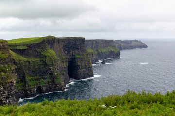 a rainy and stormy summer day at the famous cliffs of moher in the irish County Clare
