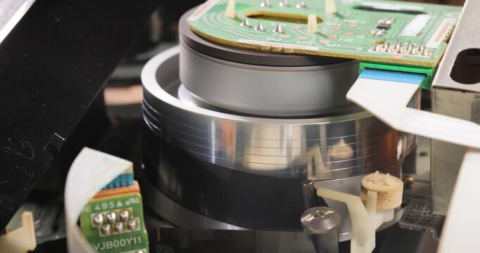 Video helical head vhs mechanism reading a video cassette VHS.