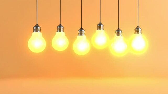 Two illuminated light bulbs stand out from a row of unlit bulbs