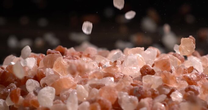 Himalayan pink salt in a super slow motion, natural mineral seasoning for healthy cooking and spa concepts. Super slow motion 1500 fps.