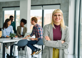 Obraz premium Portrait of a smart young businesswoman using a tablet computer in the office or classroom. Startup and succesful business concept or education and student concept