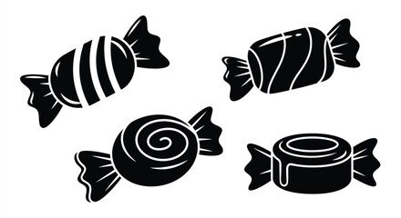 Four black candies displayed in a striking silhouette © MDJAMAL