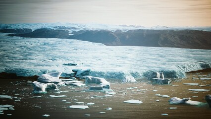 In a tranquil scene, massive icebergs drift quietly in still waters. © icetray