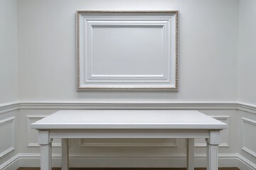 Fototapeta premium Empty ornate white picture frame hangs above a simple white console table in a minimalist room