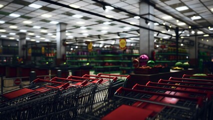 A bustling grocery store is filled with colorful produce and shopping carts. Shoppers explore the aisles, while lights create a warm, inviting atmosphere in the evening.