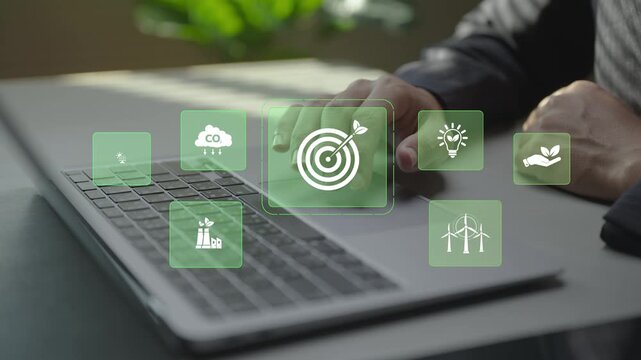 Digital sustainability management with virtual icons for green energy, carbon reduction and ESG metrics. Business professional monitoring sustainability goals and environmental performance online.