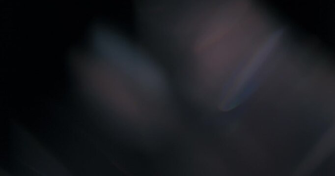 Discover captivating light reflections from prisms, ideal for designers creating unique motion graphics and abstract effects. Inspire and enhance artistic projects with stunning, ethereal visuals