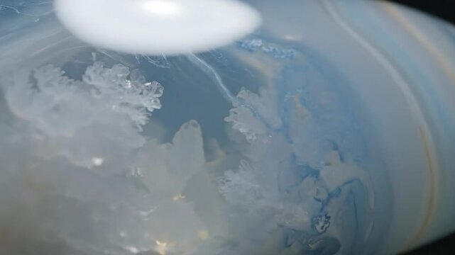 Macro View of Translucent Chalcedony with Swirling Blue and White Patterns