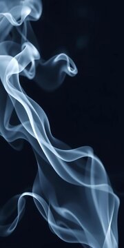 Wispy white smoke tendrils rise and swirl against a dark background, ethereal and soft,  rising,  soft