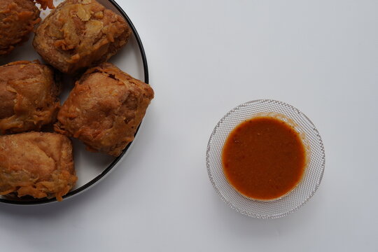 traditional indonesian fried stuffed tofu. savory crispy tahu isi with chili. deep fried stuffed tofu with peanut sauce