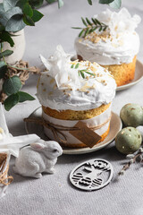Traditional Easter cakes and painted eggs in white colors .Easter Kulich	