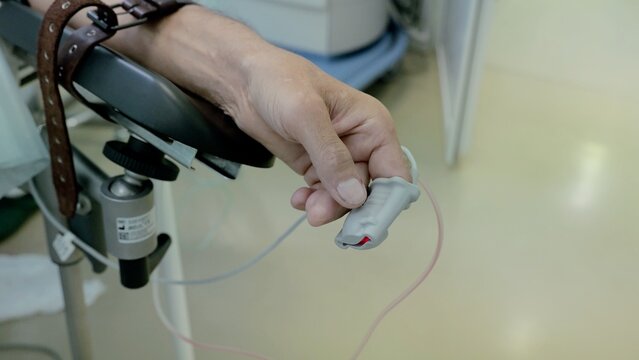 Russia Tomsk 05.07.2025: Oxygen and pulse tracking system, Patient safety ensured through continuous vital sign observation, Comprehensive bedside sensor setup supports safe postoperative