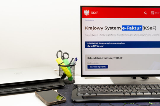 Czestochowa, Poland - February 1, 2026: From February 1, the KSeF system, online invoice registration, will be mandatory. Pictured: a phone with the KSEF website, cash, 
