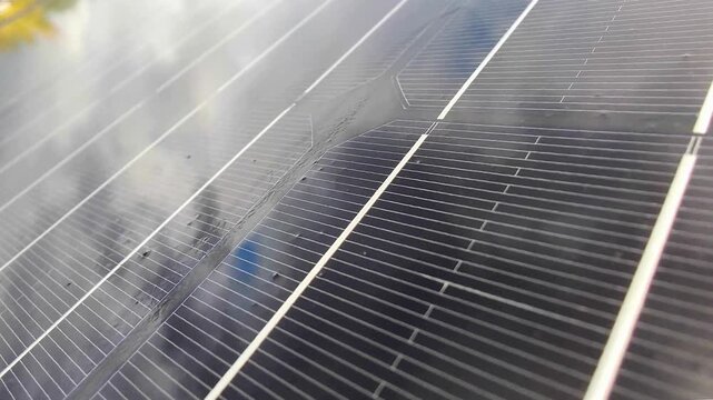 Macro Texture of Polycrystalline Silicon Solar Cell showing Photovoltaic Wafer Grid and Sun Flare Reflection for Clean Energy Technology
