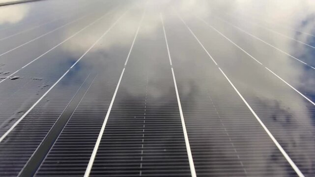 Macro Texture of Polycrystalline Silicon Solar Cell showing Photovoltaic Wafer Grid and Sun Flare Reflection for Clean Energy Technology