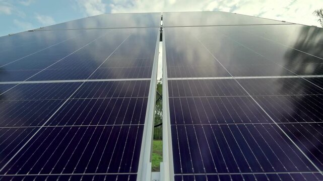 Macro Texture of Polycrystalline Silicon Solar Cell showing Photovoltaic Wafer Grid and Sun Flare Reflection for Clean Energy Technology