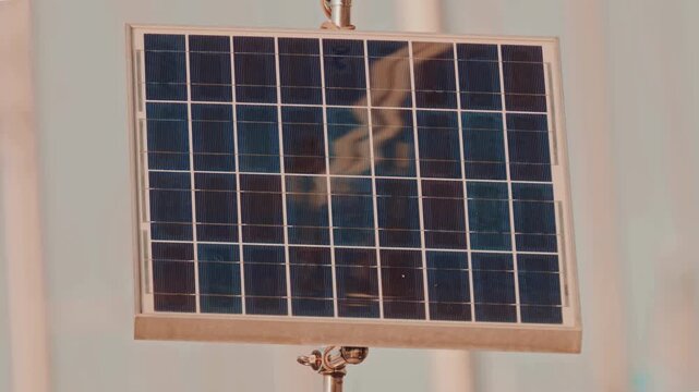 Macro Texture of Polycrystalline Silicon Solar Cell showing Photovoltaic Wafer Grid and Sun Flare Reflection for Clean Energy Technology