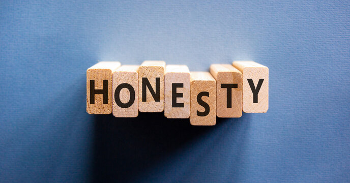 Honesty word symbol. Concept word Honesty on beautiful wooden blocks. Beautiful blue background. Business honesty concept. Copy space.