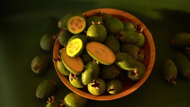Feijoa green fruit bowl. Vegetarian food on table