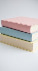 Stack of Softcover Books in Pastel Colors with Minimalist Style on Neutral Background