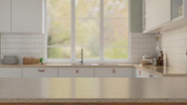 Elegance white marble kitchen tabletop with over blurred white kitchen in background