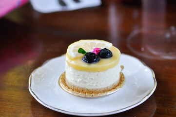 lemon cheese tart or lemon cheesecake with lemon and blueberry topping