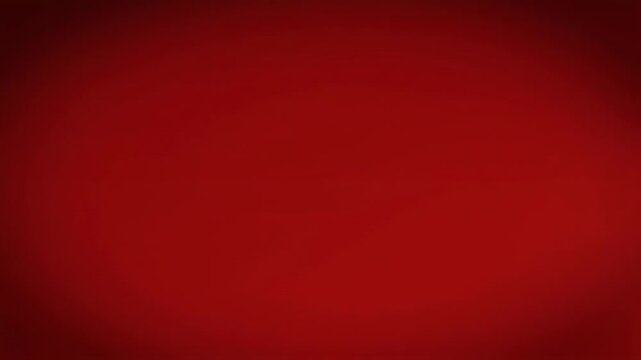 A vibrant red background with a soft spotlight effect. This abstract, gradient backdrop is perfect for design.