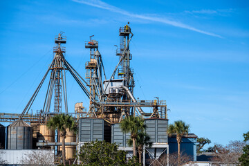 Palm trees in front of a Florida industrial plant
