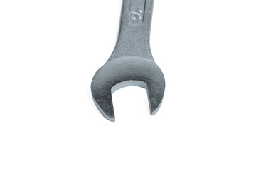 Single open-end wrench isolated on white background. Minimal product photography emphasizing shape, steel finish, and copy space.