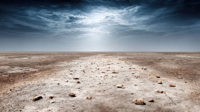 A dusty, parched desert landscape under a dramatic cloudy sky