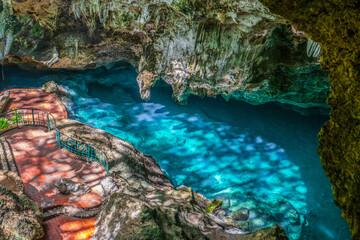 Santo Domingo,Dominican Republi: Tourists at Los Tres Ojos(The Three Eyes) National Park,three lakes in open-air limestone cave,created centuries ago,located in the Mirador del Este park © Florin